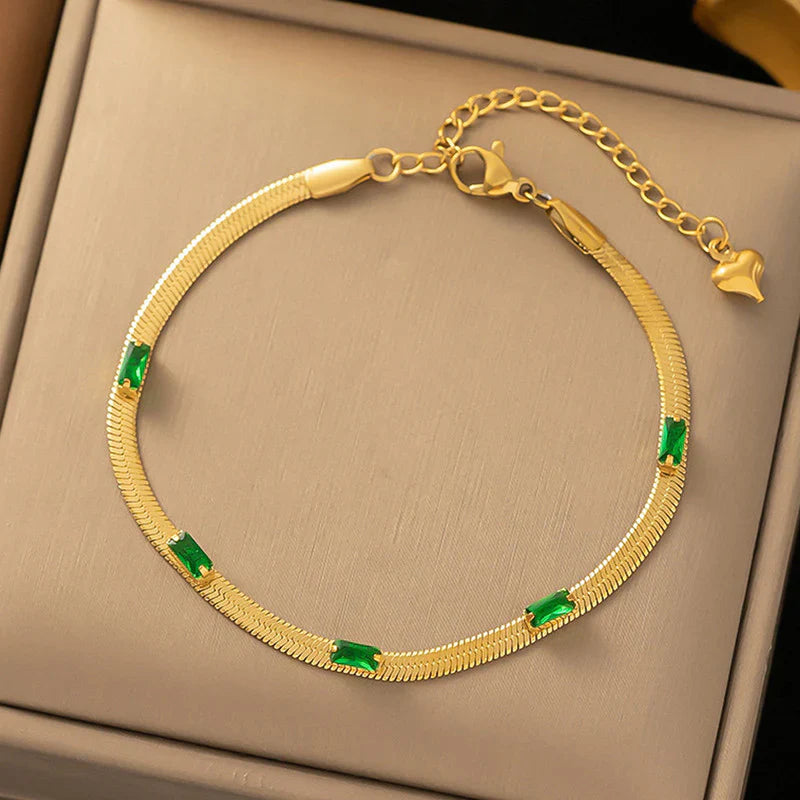 Elegant Gold Snake Chain Bracelet with Green Baguette Stones