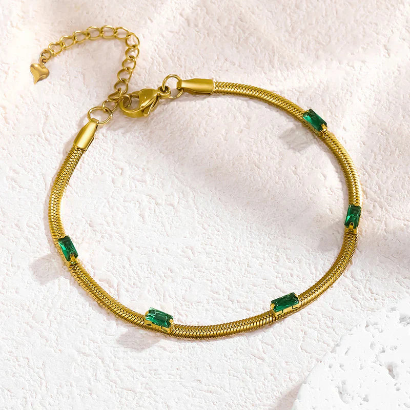 Elegant Gold Snake Chain Bracelet with Green Baguette Stones