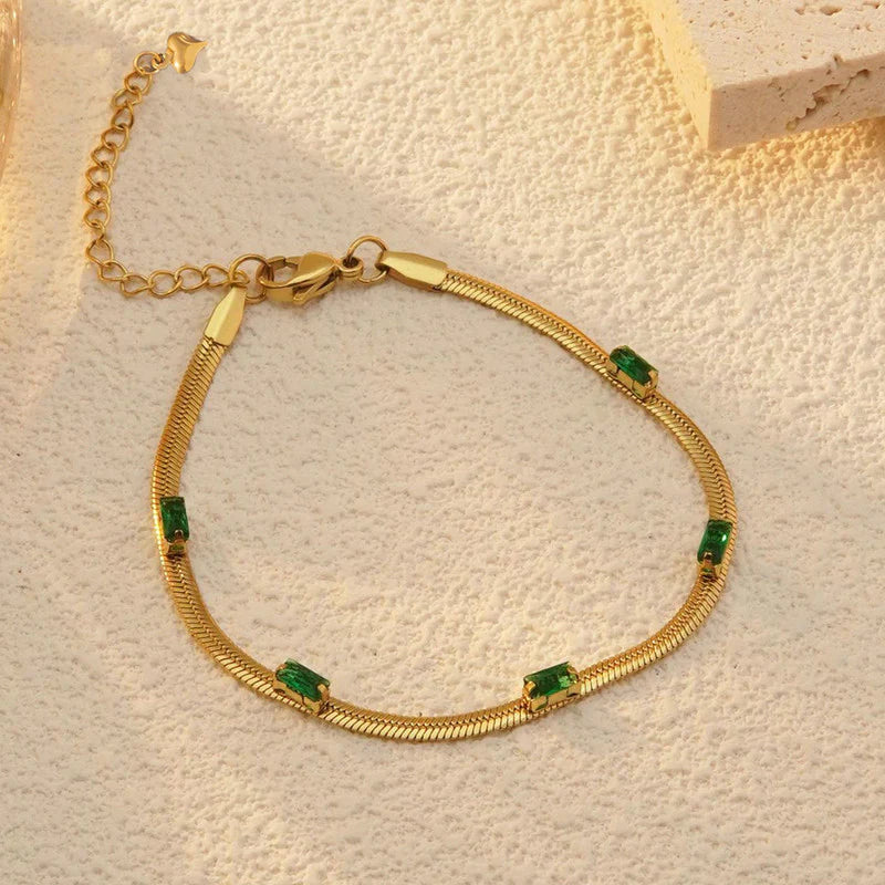 Elegant Gold Snake Chain Bracelet with Green Baguette Stones