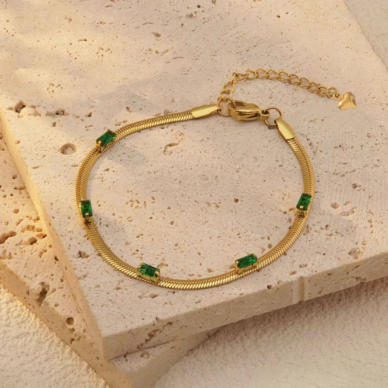 Elegant Gold Snake Chain Bracelet with Green Baguette Stones