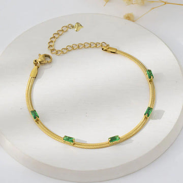 Elegant Gold Snake Chain Bracelet with Green Baguette Stones