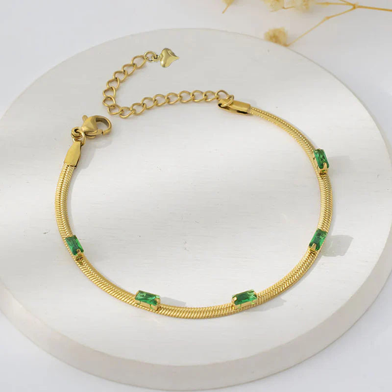 Elegant Gold Snake Chain Bracelet with Green Baguette Stones