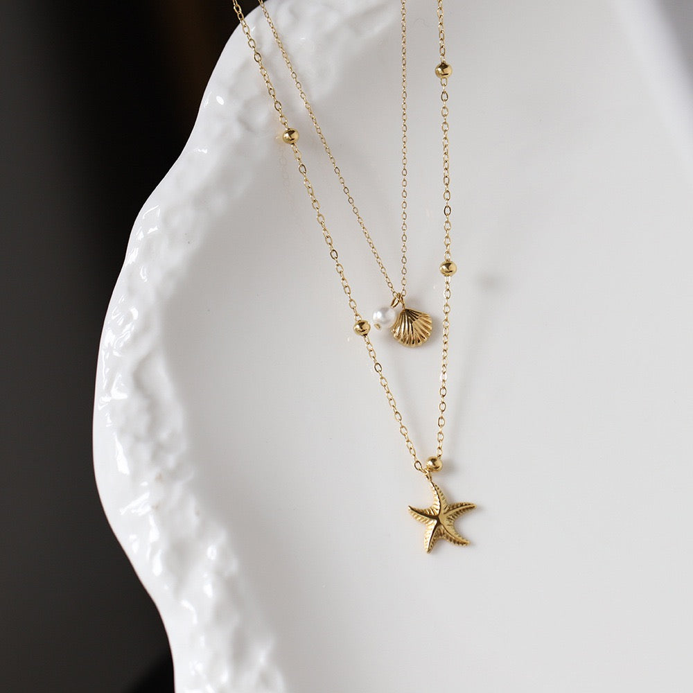Golden Starfish & Shell Charm Necklace with Pearl Accent