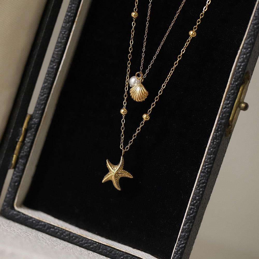 Golden Starfish & Shell Charm Necklace with Pearl Accent