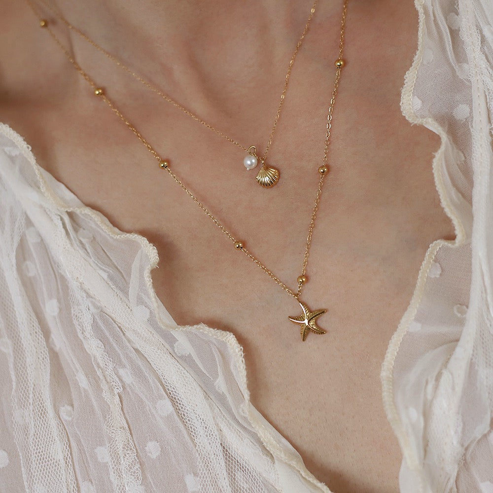 Golden Starfish & Shell Charm Necklace with Pearl Accent